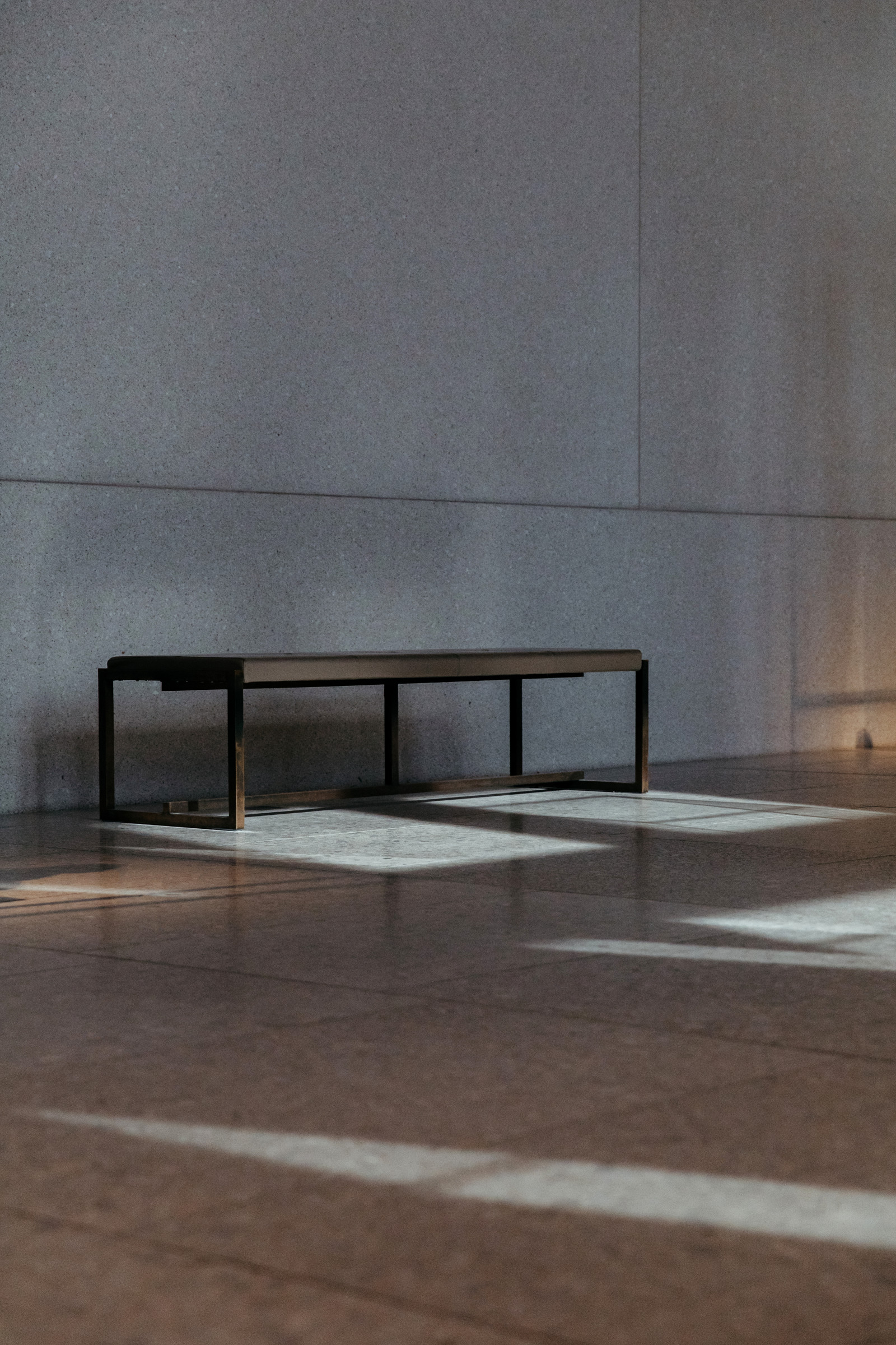 A quiet bench in a sunlit room